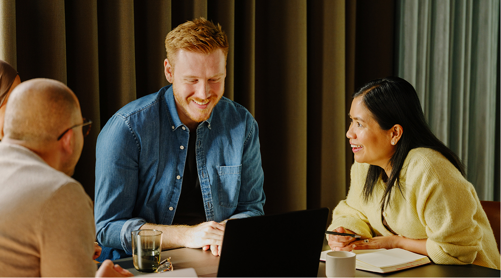 Four colleagues in conversation